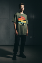 Army green peeking cat sunset vintage tee — dark moody editorial — Bad Luck Boutique